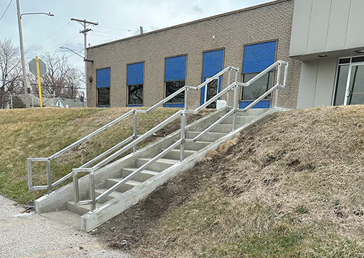 Stainless steel exterior railing for stairs with 12 cement steps
