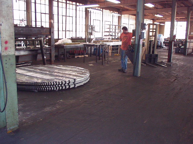 Mist eliminator about 6 feet in diameter on shop floor (with person for scale)