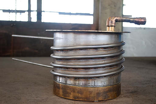 copper pot part that hooks to fuel lines? (upside down in photo)