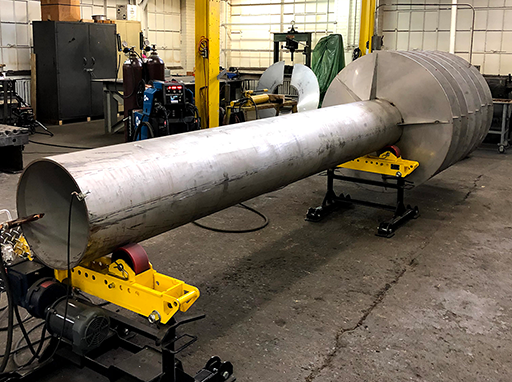 vibratory feeder in early phase showing long interior metal cylinder that panels are welded to