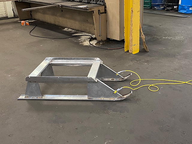 Stainless steel smitty sled used in ice fishing