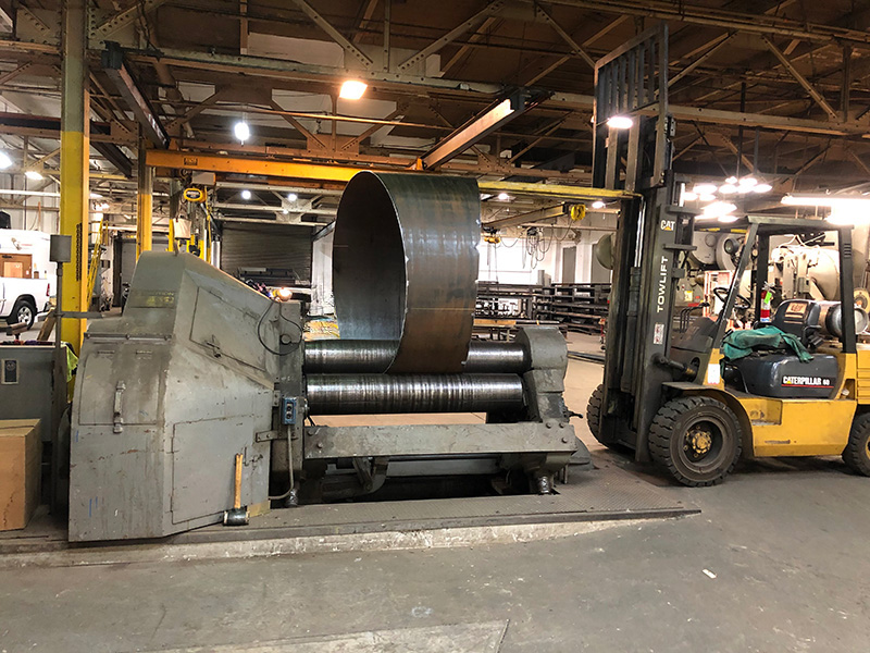 Portion of the large elbow pipe being rolled