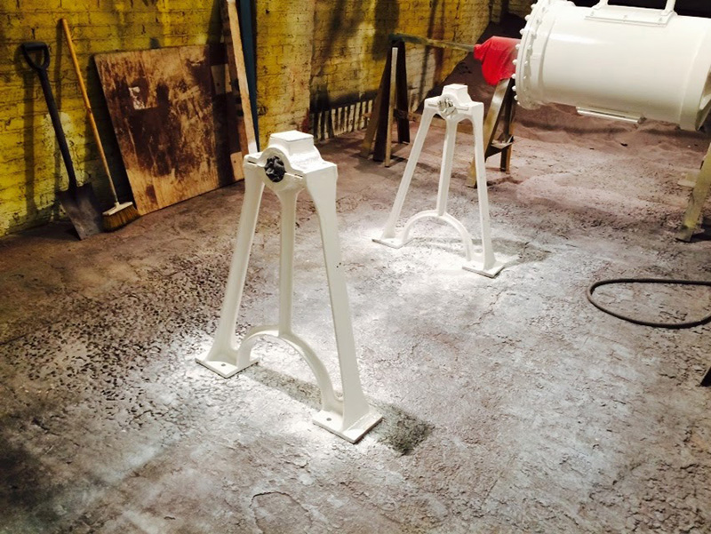 Painted legs (tripod shaped) that the mill cylinder sits upon